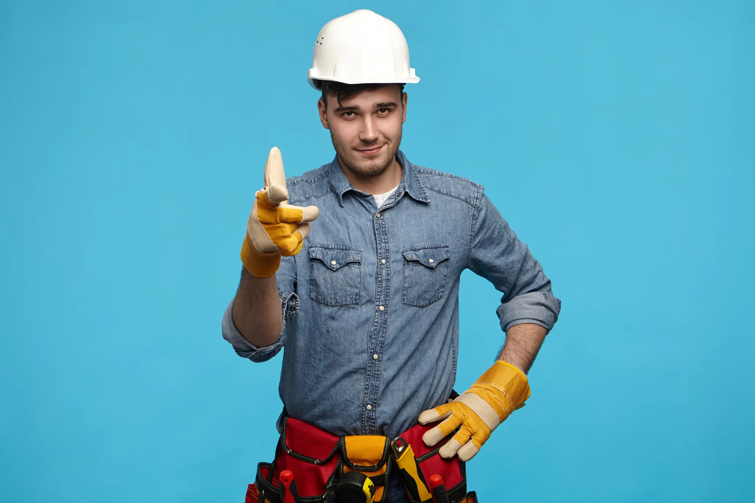 horizontal-shot-of-handsome-young-maintenance-service-worker-wearing-white-helmet